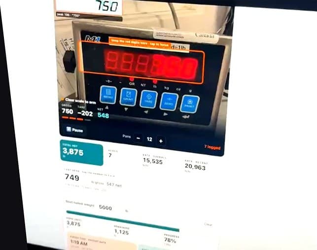 DeepGrade scale capture running on a boat scale: the camera reads 750 lb gross off the indicator, subtracts a 202 lb tare, and shows 548 lb net with a running offload total.